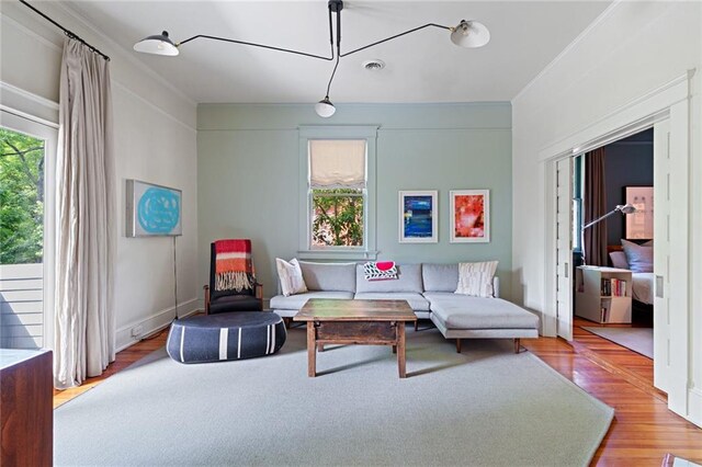 living room with visible vents and wood finished floors
