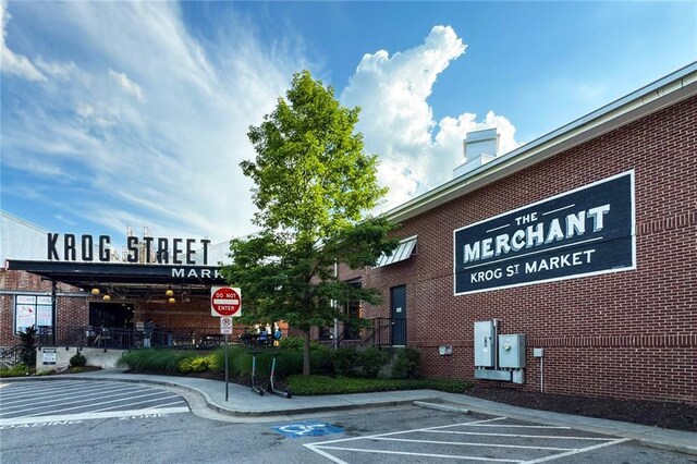 view of property featuring uncovered parking