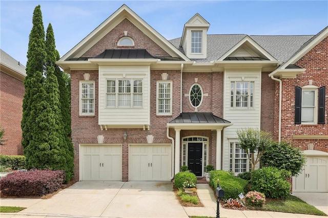 6259 Spalding Dr, Peachtree Corners, GA 30092 - view of front of home featuring driveway, brick siding, and a standing seam roof