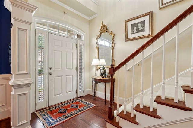 6259 Spalding Dr, Peachtree Corners, GA 30092 - foyer entrance with healthy amount of natural light, stairway, wood finished floors, decorative columns, and ornamental molding