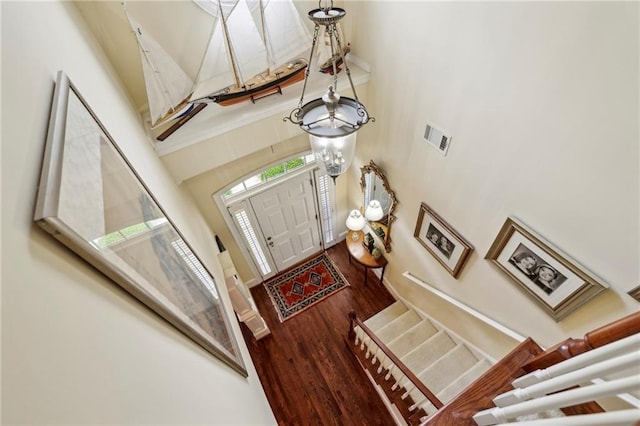 6259 Spalding Dr, Peachtree Corners, GA 30092 - foyer featuring wood finished floors, a high ceiling, and stairs