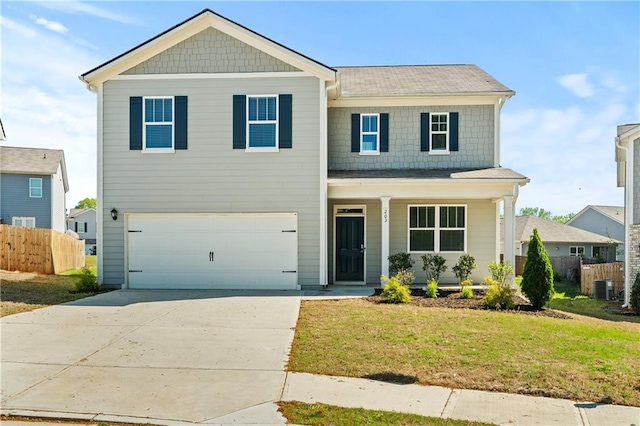 view of front of property featuring concrete driveway, an attached garage, fence, cooling unit, and a front yard