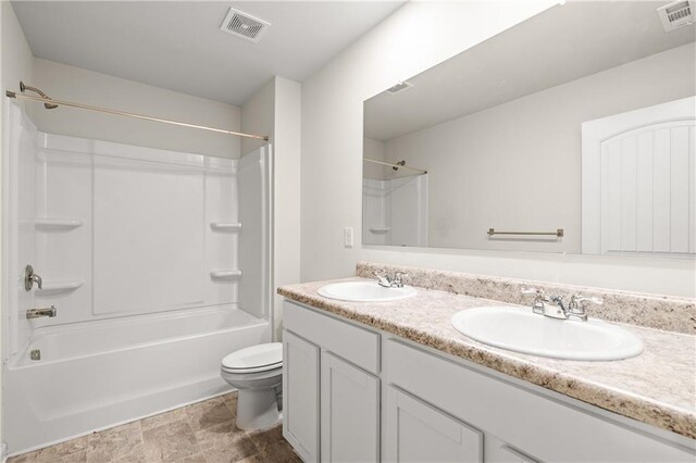 bathroom featuring visible vents, a sink, and toilet