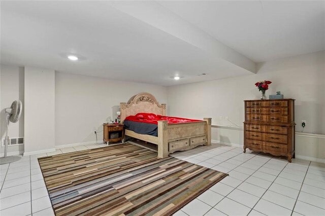 bedroom with light tile patterned floors