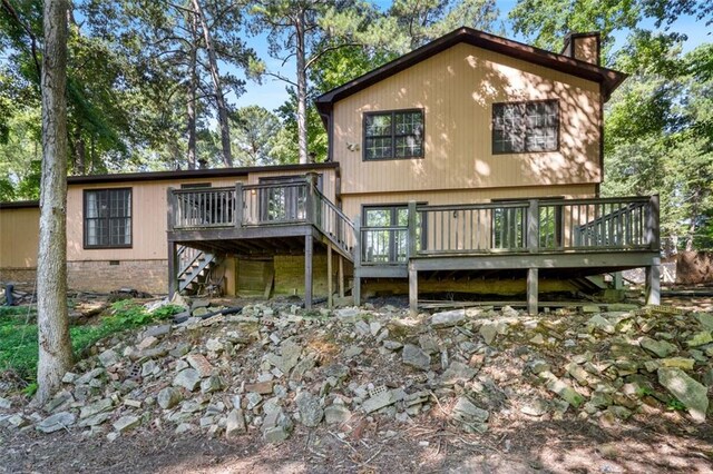 rear view of property with a deck