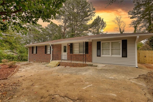 ranch-style home with a porch