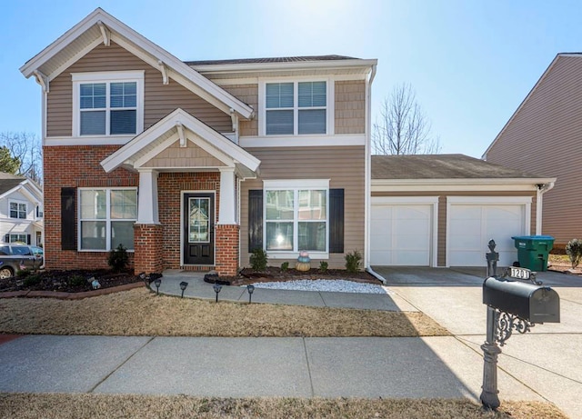 view of front of house featuring a garage, brick siding, and driveway