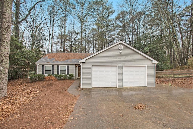 ranch-style home with a garage