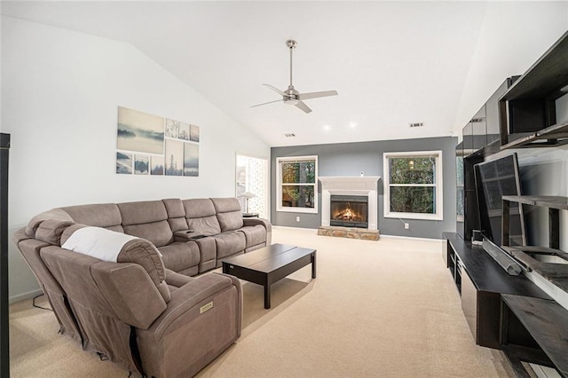 carpeted living room featuring vaulted ceiling and ceiling fan