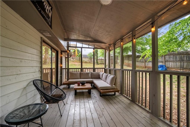 sunroom / solarium featuring an outdoor hangout area