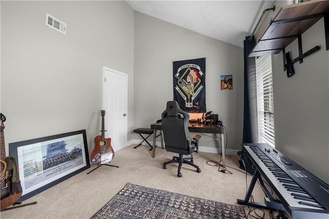 home office featuring visible vents, carpet flooring, baseboards, and lofted ceiling