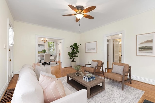 4 Arc Way NE, Atlanta, GA 30305 - living room with a chandelier, wood finished floors, ceiling fan, crown molding, and baseboards