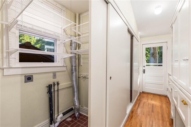 4 Arc Way NE, Atlanta, GA 30305 - laundry area featuring electric dryer hookup, baseboards, and wood finished floors