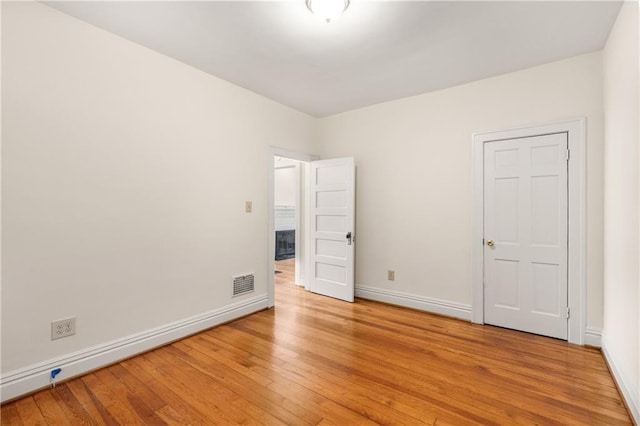 4 Arc Way NE, Atlanta, GA 30305 - unfurnished bedroom with light wood-style flooring and baseboards