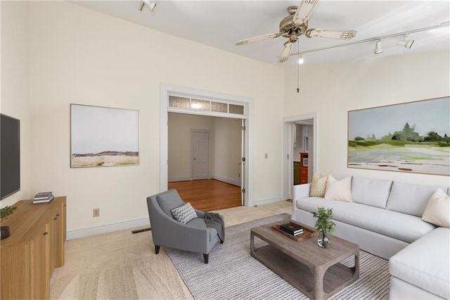 4 Arc Way NE, Atlanta, GA 30305 - living room with light colored carpet, ceiling fan, track lighting, and baseboards