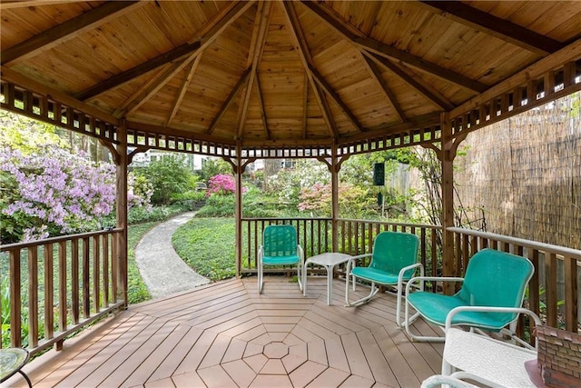 wooden terrace featuring a gazebo