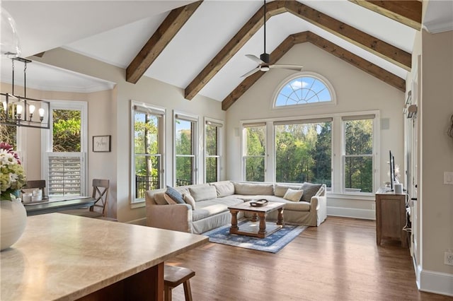 living room featuring dark wood-style flooring, a ceiling fan, beamed ceiling, baseboards, and high vaulted ceiling