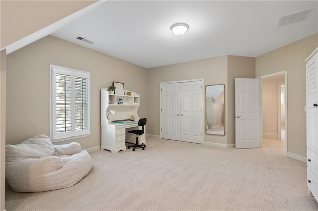 carpeted office space with baseboards