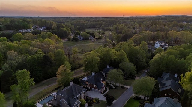 drone / aerial view of a heavily wooded area