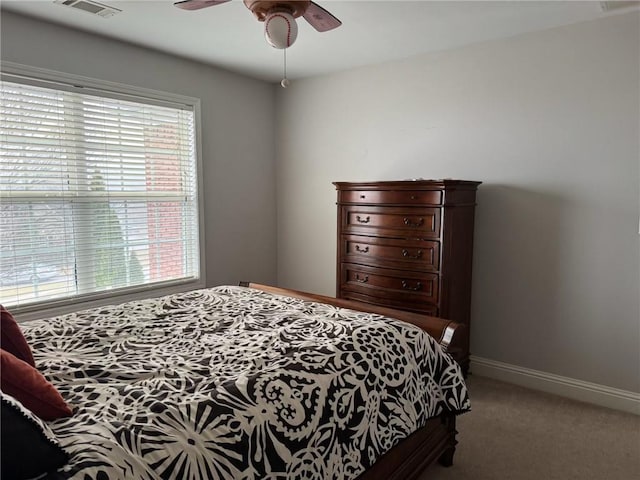 bedroom with ceiling fan and carpet flooring