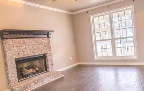 unfurnished living room with ceiling fan, dark hardwood / wood-style floors, and ornamental molding