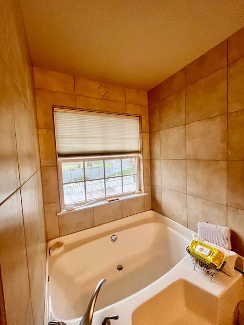 bathroom with a washtub