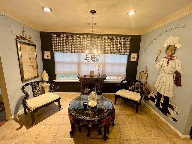 living area featuring tile patterned flooring, ornamental molding, and a chandelier