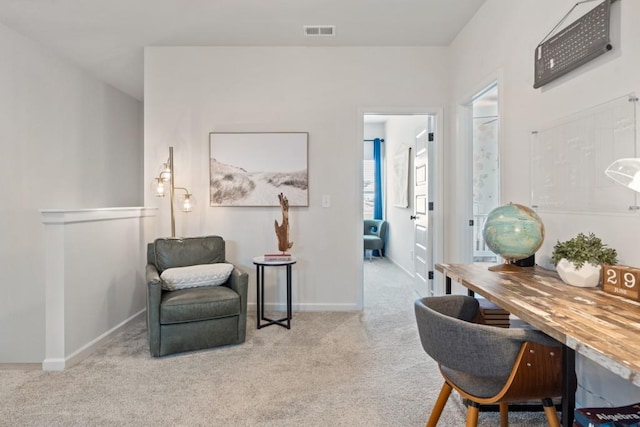 sitting room featuring carpet flooring, baseboards, and visible vents