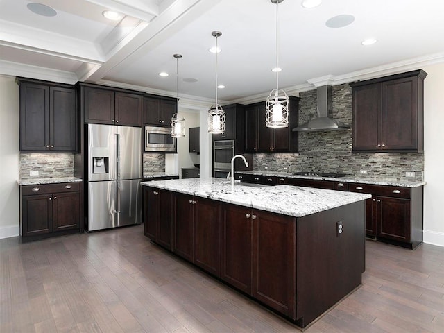 kitchen featuring stainless steel appliances, wall chimney range hood, dark hardwood / wood-style floors, an island with sink, and pendant lighting