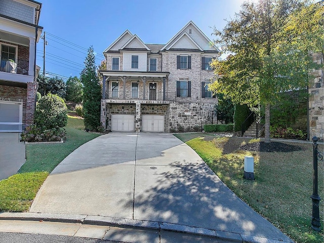 view of front of house with a front yard and a garage