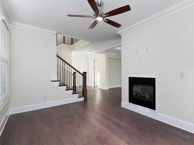 unfurnished living room featuring ceiling fan, ornamental molding, and dark wood-type flooring