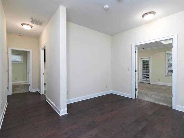 hall with dark wood-type flooring