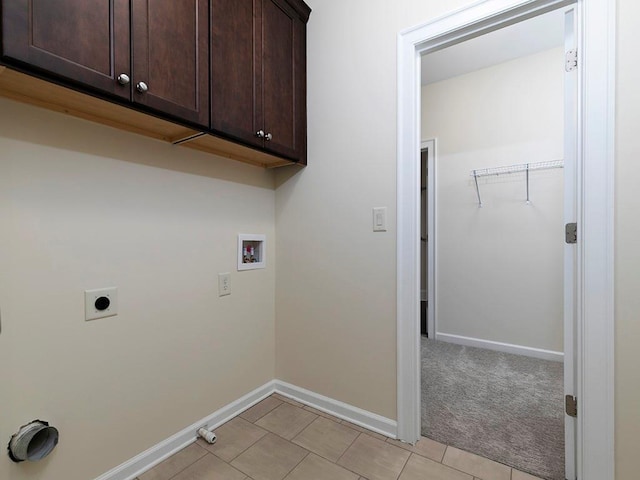 laundry room featuring washer hookup, electric dryer hookup, cabinets, and gas dryer hookup