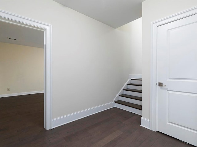 staircase featuring hardwood / wood-style flooring