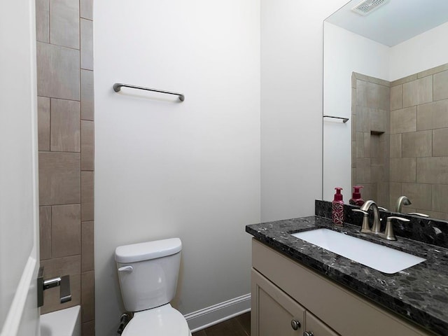 bathroom with vanity and toilet