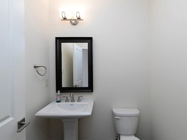 bathroom featuring toilet