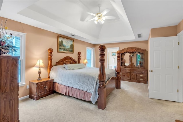 2810 Olde Town Park Dr, Norcross, GA 30071 - bedroom featuring ceiling fan, baseboards, light carpet, and a tray ceiling