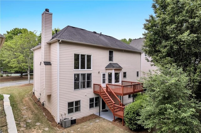 2810 Olde Town Park Dr, Norcross, GA 30071 - back of property featuring cooling unit, a chimney, a deck, a shingled roof, and stairway