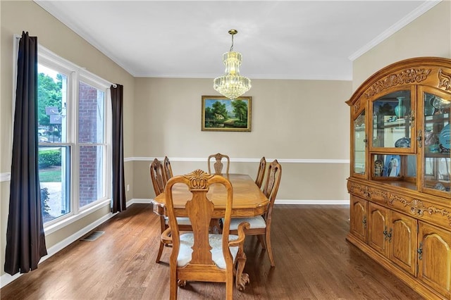 2810 Olde Town Park Dr, Norcross, GA 30071 - dining room with crown molding, visible vents, baseboards, an inviting chandelier, and dark wood-style flooring