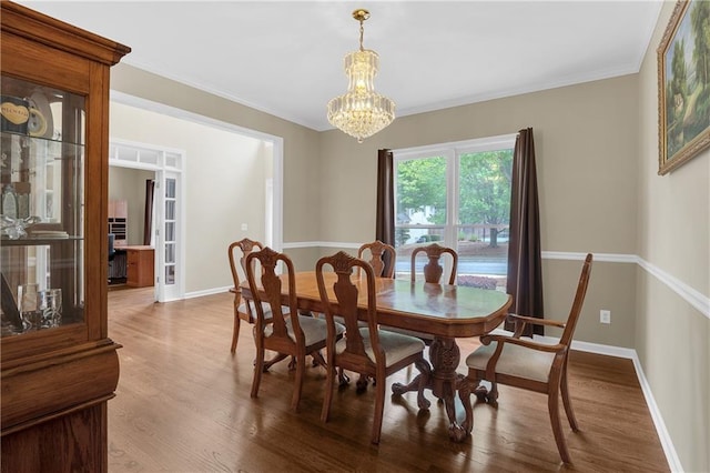 2810 Olde Town Park Dr, Norcross, GA 30071 - dining area with an inviting chandelier, wood finished floors, and baseboards