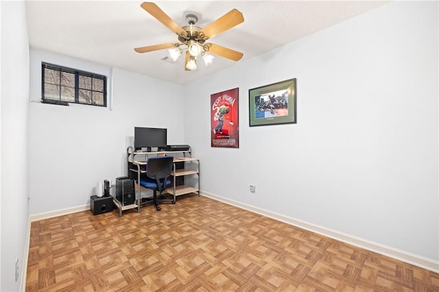 office with a ceiling fan and baseboards