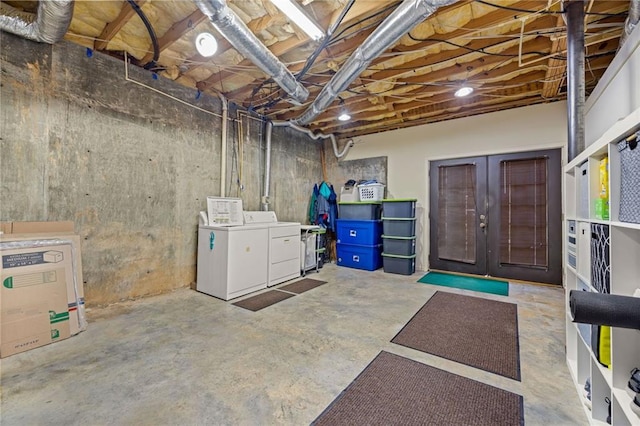 unfinished below grade area featuring separate washer and dryer and french doors