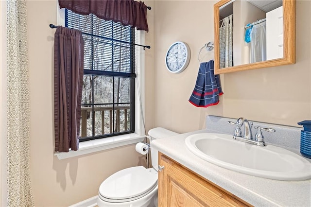 full bath featuring vanity and toilet