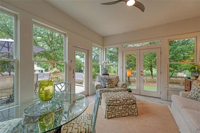 sunroom / solarium with ceiling fan