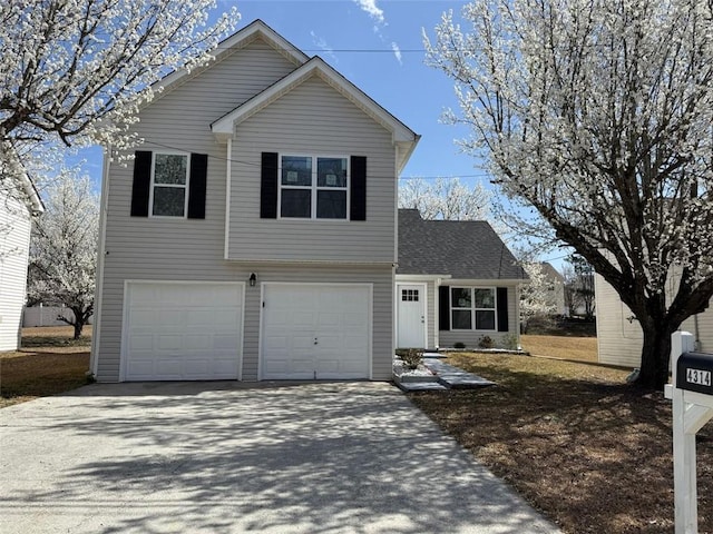 traditional-style home with an attached garage and driveway