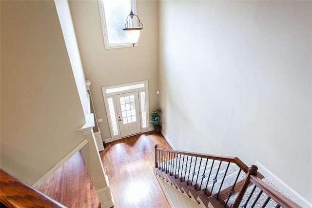 240 Chandler Walk, Loganville, GA 30052 - foyer entrance with light wood-style flooring, stairway, and a high ceiling