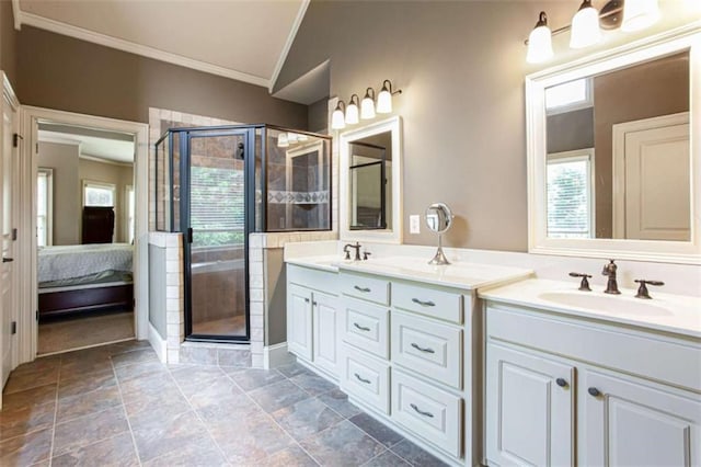 240 Chandler Walk, Loganville, GA 30052 - ensuite bathroom featuring ornamental molding, double vanity, a shower stall, and stone finish floors