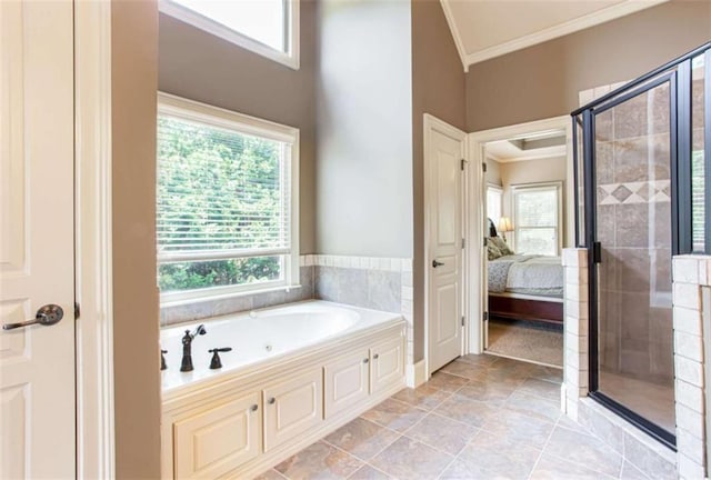 240 Chandler Walk, Loganville, GA 30052 - full bathroom with ornamental molding, a stall shower, a jetted tub, and ensuite bath