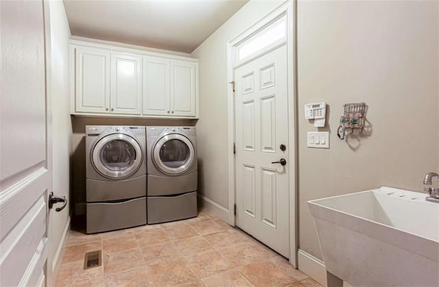 240 Chandler Walk, Loganville, GA 30052 - laundry room with washer and dryer and cabinet space