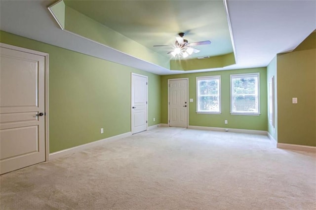 240 Chandler Walk, Loganville, GA 30052 - unfurnished room with a ceiling fan, light colored carpet, and a tray ceiling